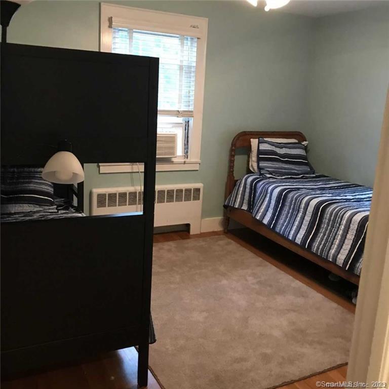 39 Masons Island Road Stonington, CT 06355 - Photo 15 of 16 a bedroom with a bed and dresser