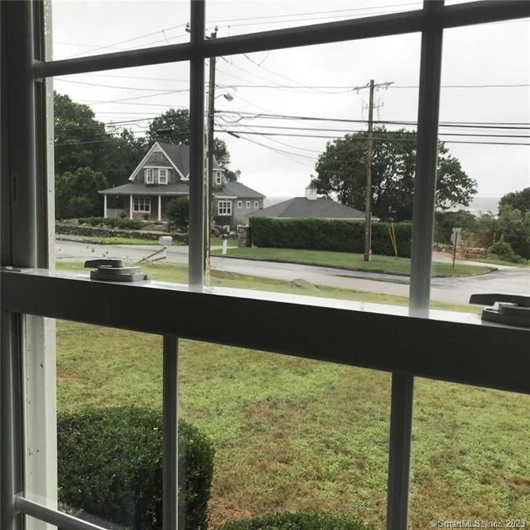 39 Masons Island Road Stonington, CT 06355 - Photo 3 of 16 a view of large window and a room