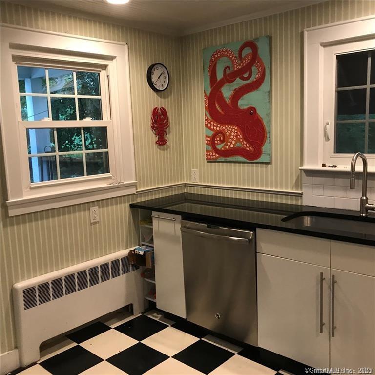 39 Masons Island Road Stonington, CT 06355 - Photo 5 of 16 a bathroom with a sink and a mirror