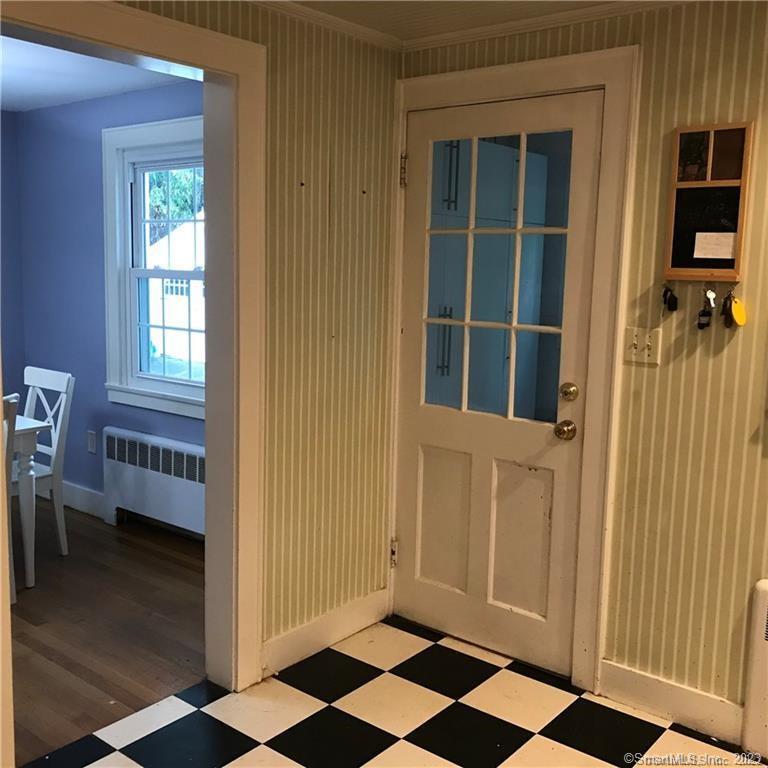 39 Masons Island Road Stonington, CT 06355 - Photo 7 of 16 a view of a closet area with a window