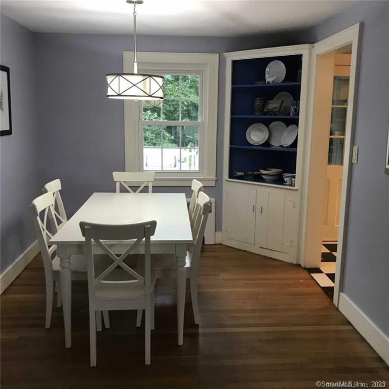 39 Masons Island Road Stonington, CT 06355 - Photo 9 of 16 a view of a dining room with furniture and window