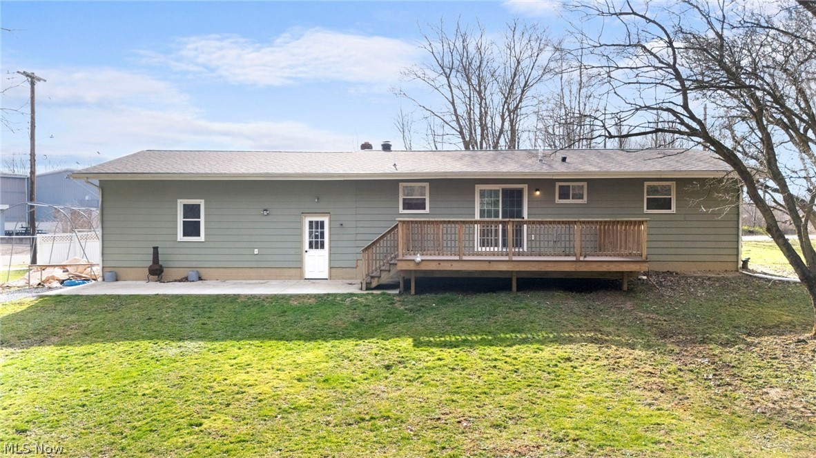 1835 Windham Road Newton Falls, OH 44444 - Photo 31 of 40 Rear view of property with a yard, a patio, and a wooden deck
