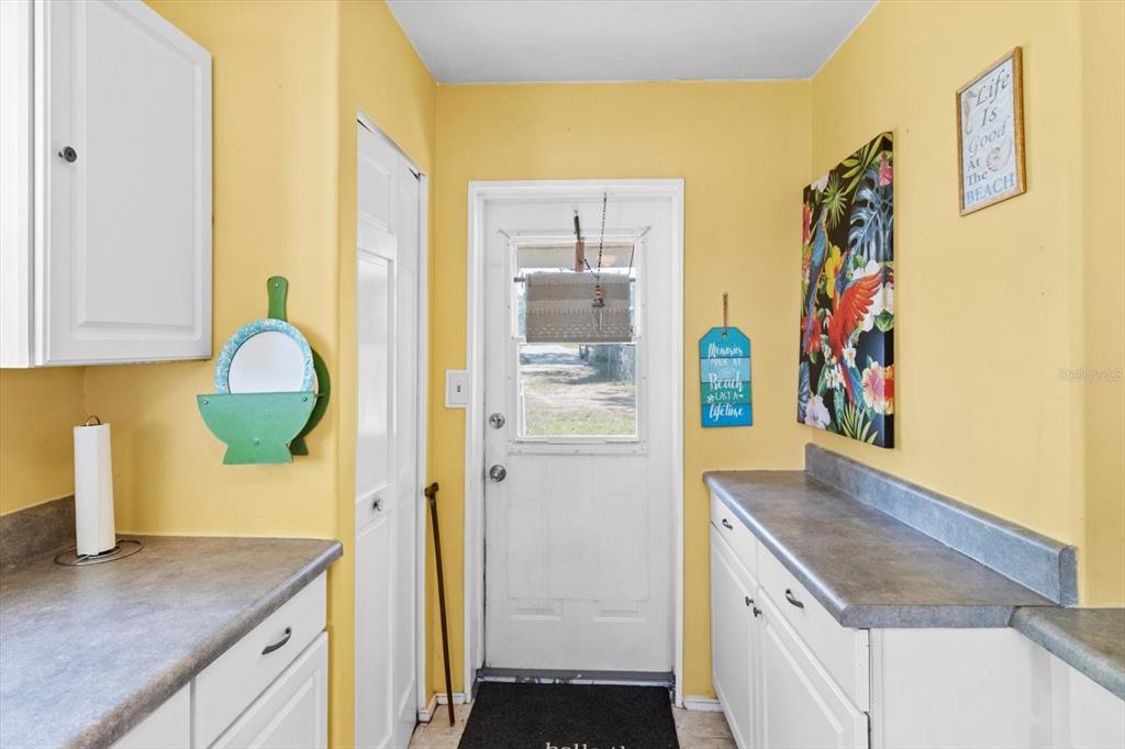 1226 South Telephone Point Road Inverness, FL 34450 - Photo 20 of 43 a kitchen with a refrigerator and a sink