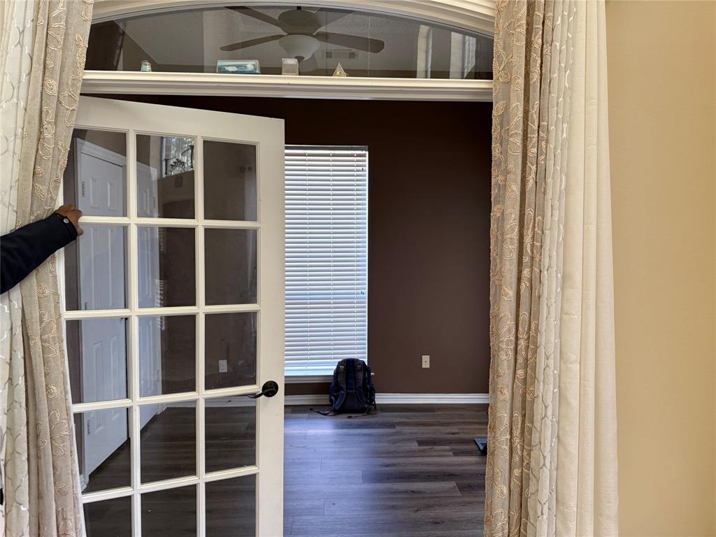 308 Santa Fe Trail Irving, TX 75063 - Photo 6 of 8 a view of a house with a large window and wooden floor