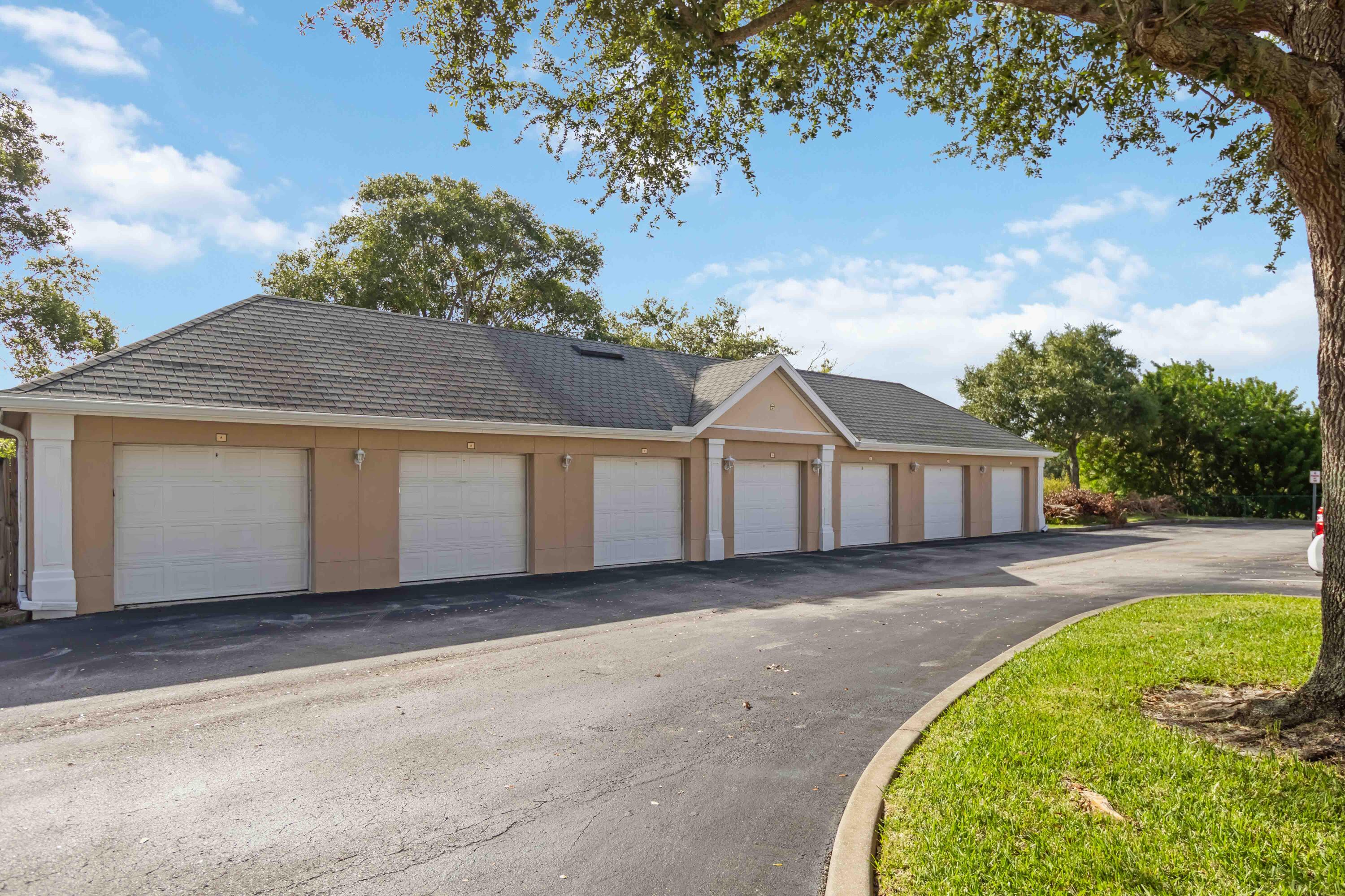 110 Turpial Way, Unit 102 Melbourne, FL 32901 - Photo 10 of 14 front view of a house with a garden