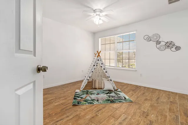 a spacious bathroom with a double vanity sink mirror and shower