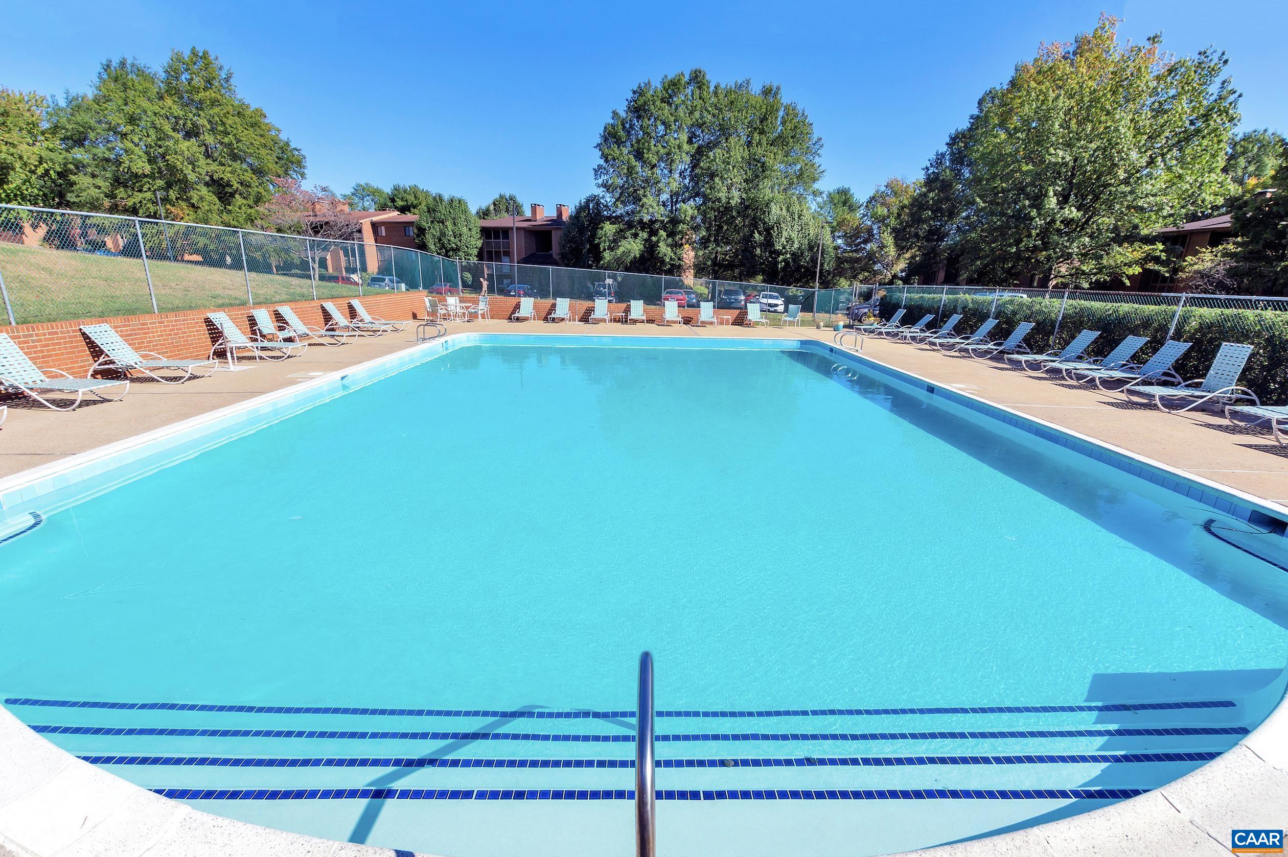 114 Turtle Creek Road, Unit 4 Charlottesville, VA 22901 - Photo 2 of 41 a view of a swimming pool with a lounge chairs