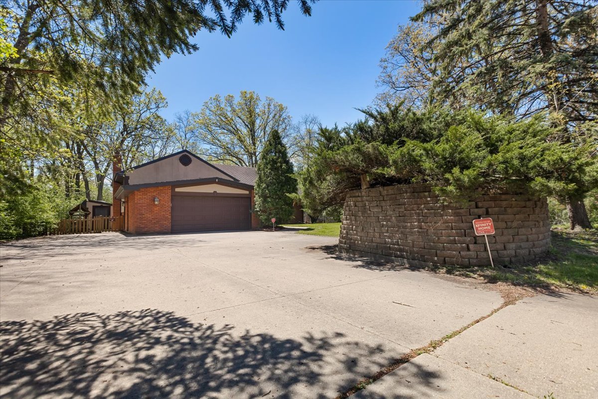 33 Half Day Road Lincolnshire, IL 60069 - Photo 1 of 38 a front view of a house with a yard and garage