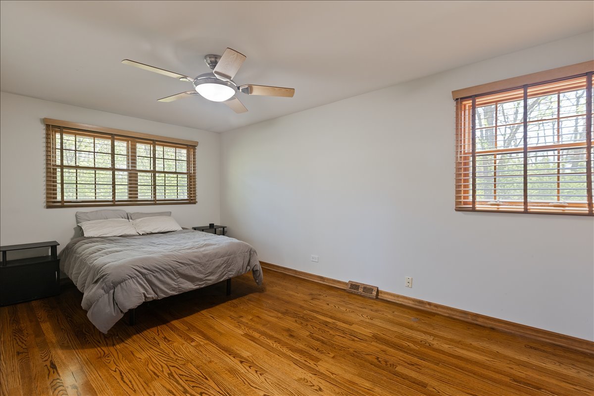 33 Half Day Road Lincolnshire, IL 60069 - Photo 16 of 38 a bedroom with a bed and window