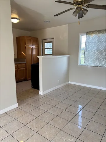 a view of a kitchen with a sink and cabinets