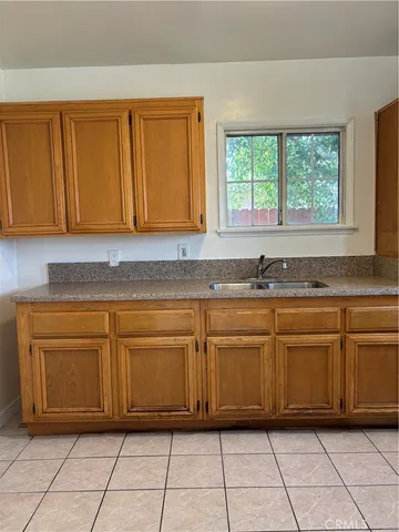 a kitchen with granite countertop cabinets and a sink