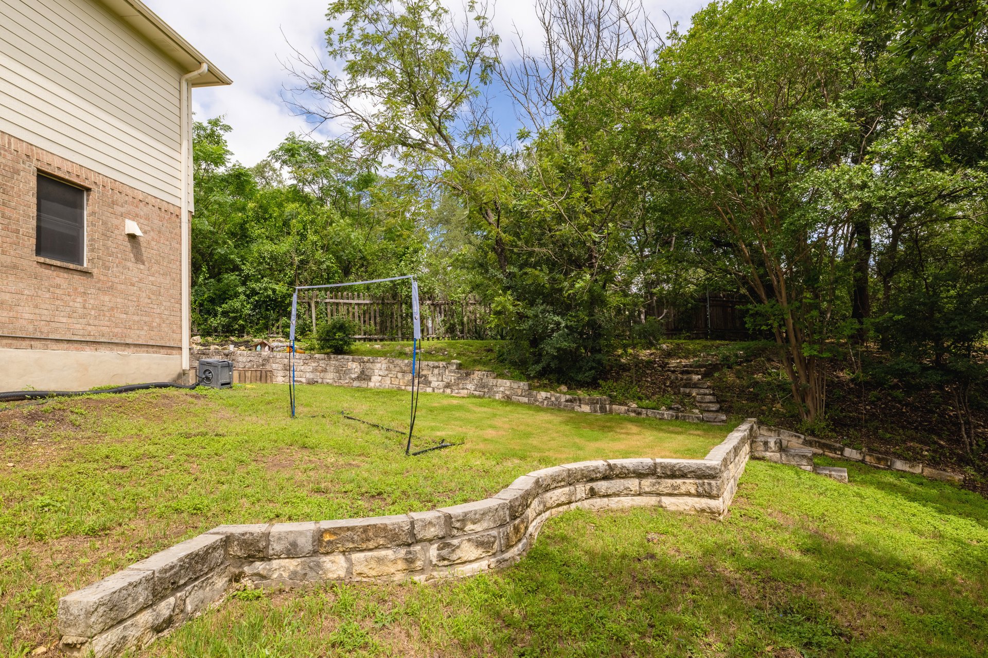 7000 Bending Oak Road Austin, TX 78749 - Photo 33 of 39 a view of a swimming pool with a bench and trees in the background