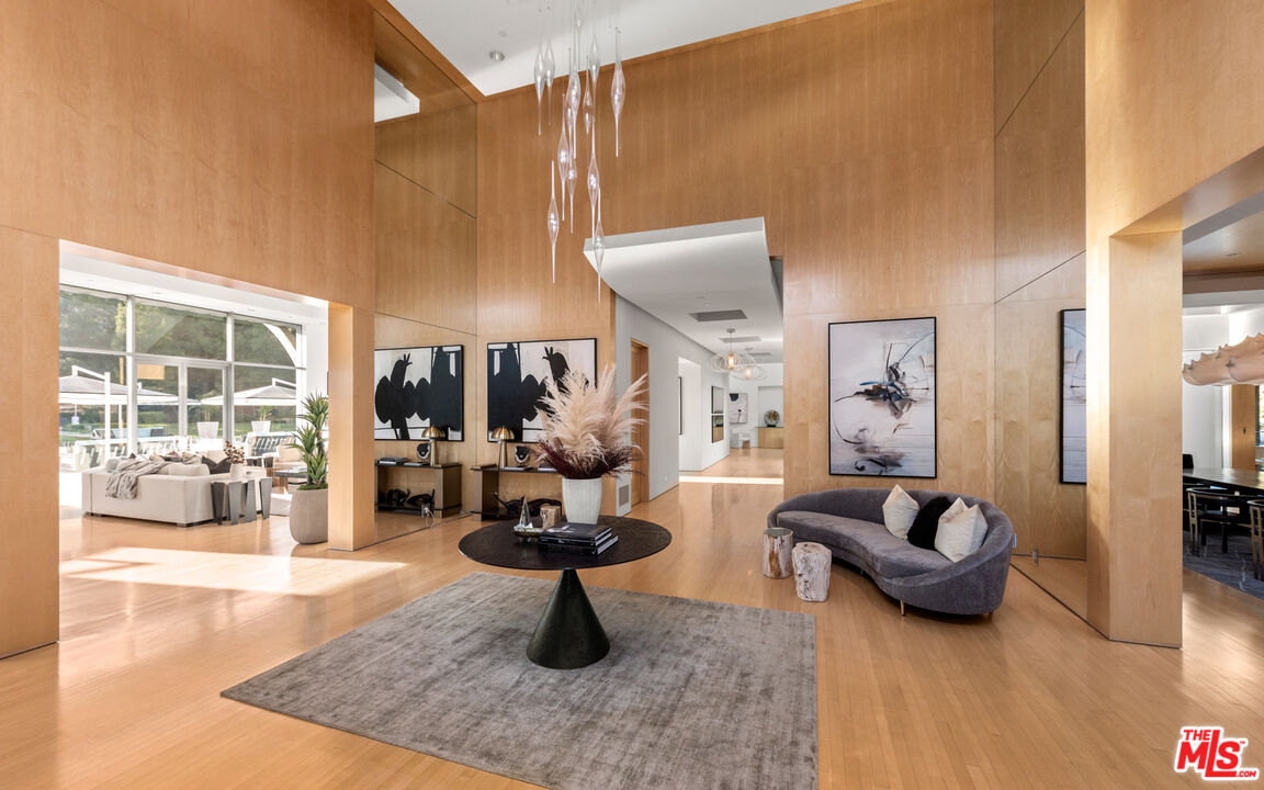 72 Beverly Park Beverly Hills, CA 90210 - Photo 12 of 38 a living room with furniture and a rug