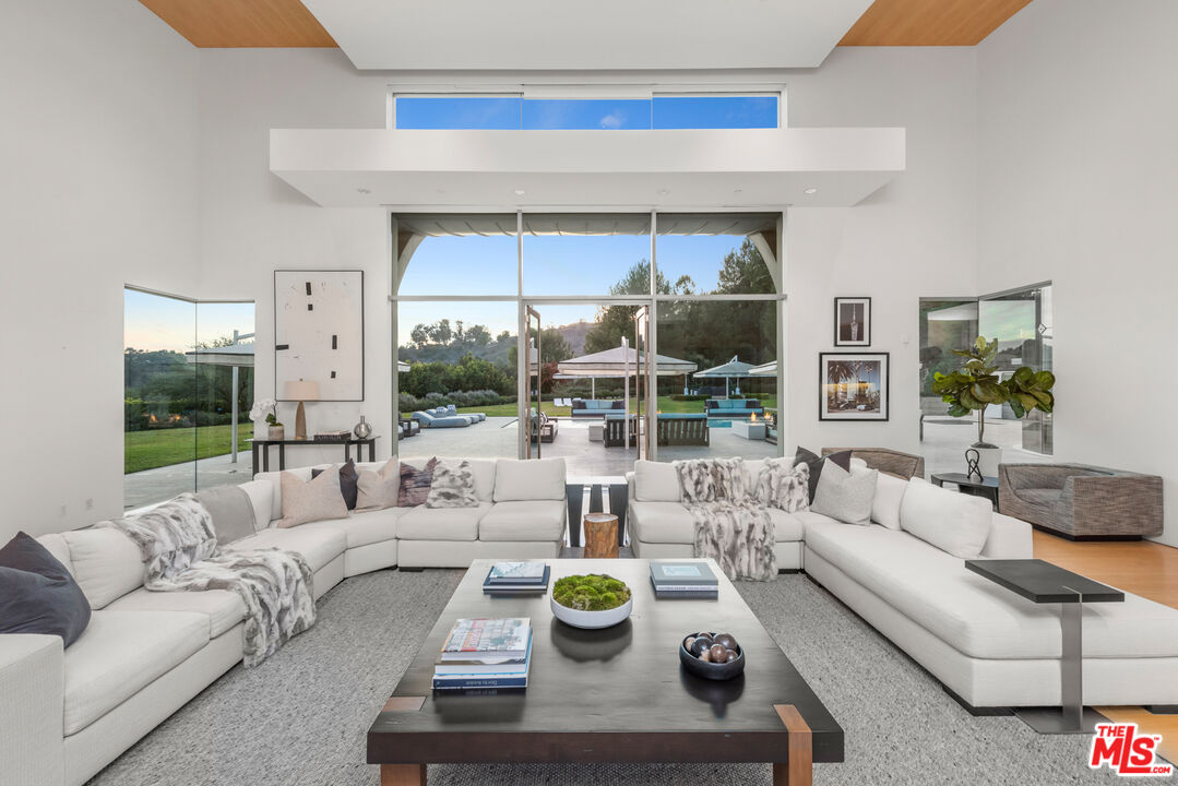 72 Beverly Park Beverly Hills, CA 90210 - Photo 14 of 38 a living room with furniture and a balcony