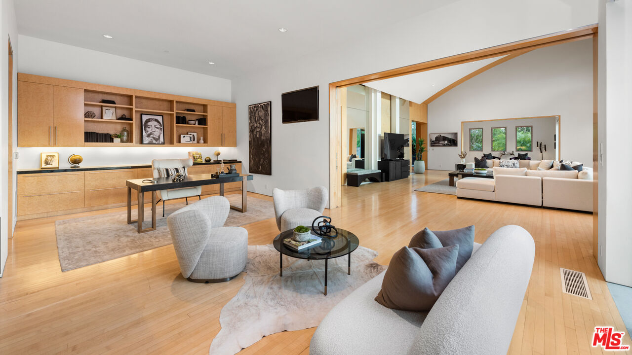 72 Beverly Park Beverly Hills, CA 90210 - Photo 15 of 38 a living room with furniture and a large window