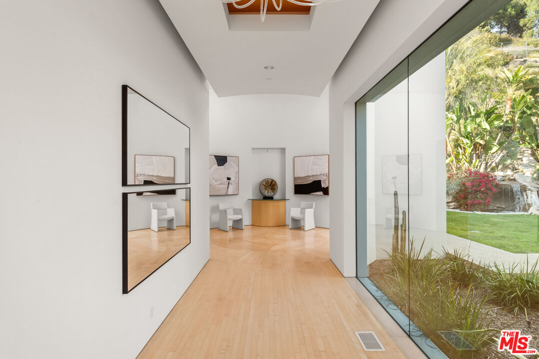 72 Beverly Park Beverly Hills, CA 90210 - Photo 23 of 38 a view of a hallway view with living room and furniture