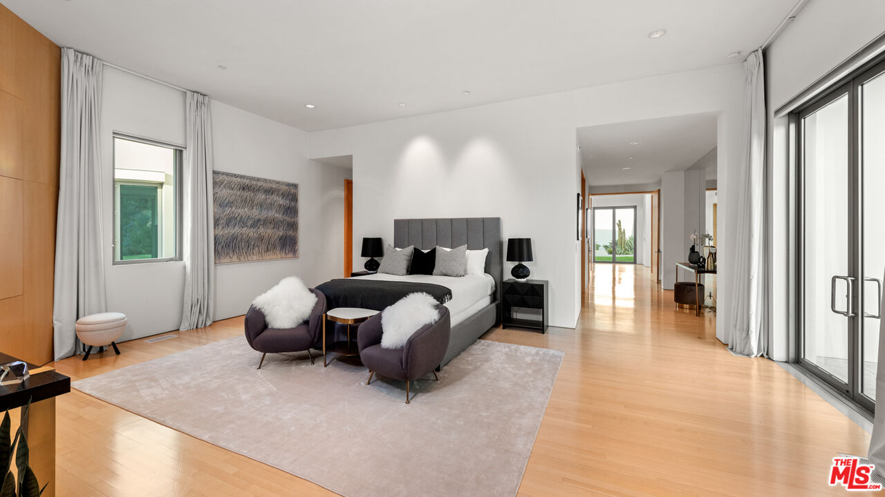 72 Beverly Park Beverly Hills, CA 90210 - Photo 24 of 38 a bed room with a bed and a large window