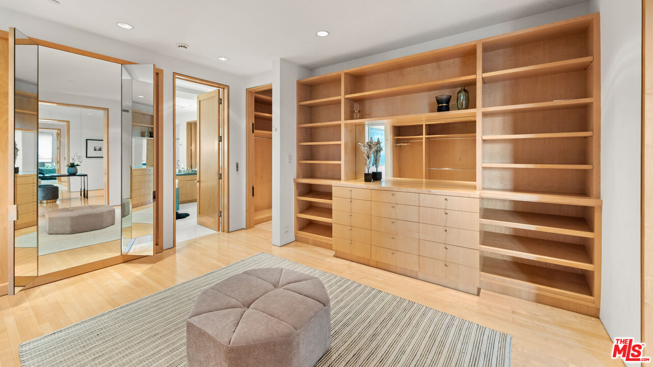 72 Beverly Park Beverly Hills, CA 90210 - Photo 27 of 38 a view of bedroom with a closet and wooden floor