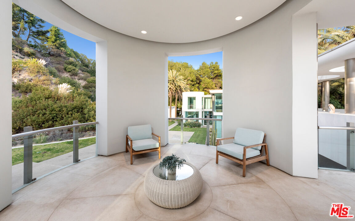 72 Beverly Park Beverly Hills, CA 90210 - Photo 33 of 38 a living room with furniture and a large window