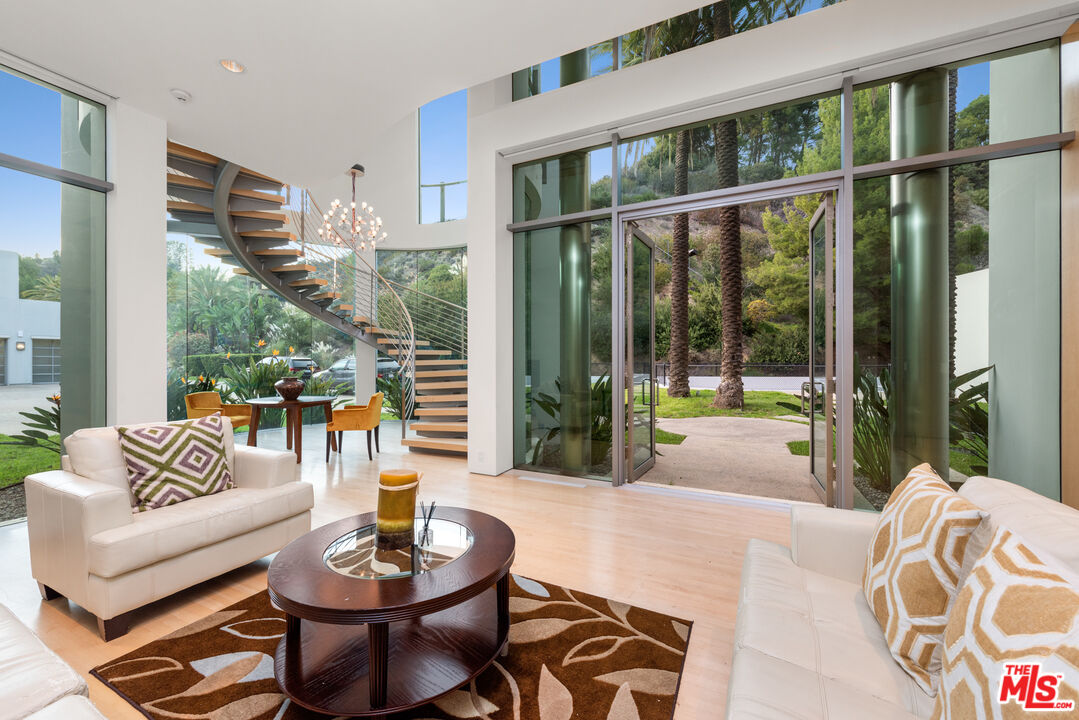 72 Beverly Park Beverly Hills, CA 90210 - Photo 35 of 38 a living room with furniture and a large window
