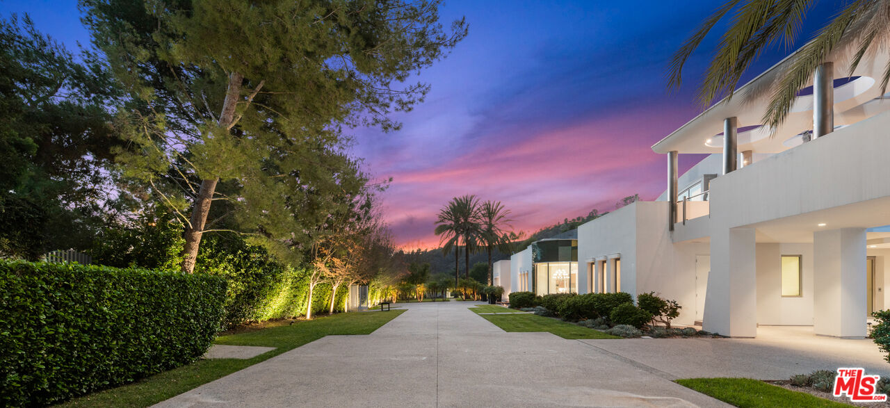 72 Beverly Park Beverly Hills, CA 90210 - Photo 4 of 38 a view of a house with a yard