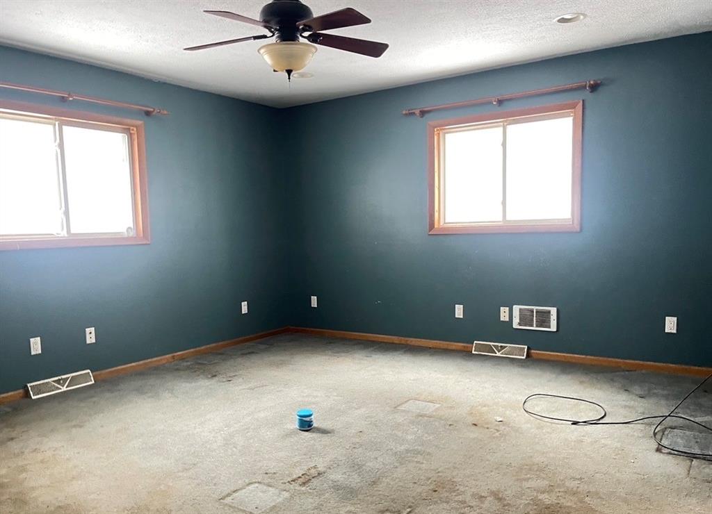 88 Fleming Road Grove City, PA 16127 - Photo 12 of 20 an empty room with windows and fan