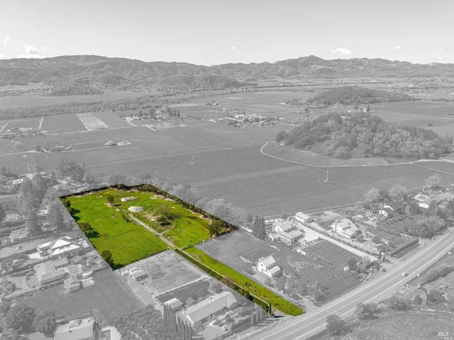 a view of a yard with an ocean