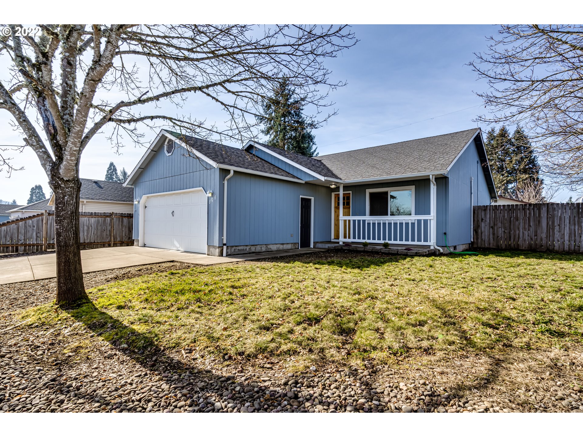 806 Hazelnut Lane Springfield, OR 97478 - Photo 1 of 28 a house with trees in front of it