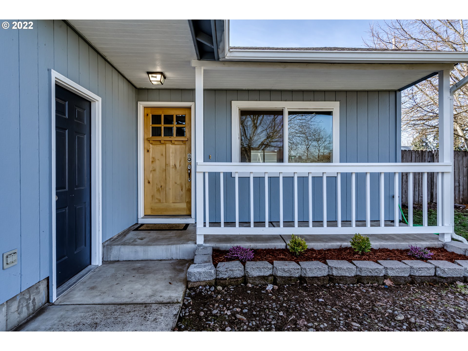 806 Hazelnut Lane Springfield, OR 97478 - Photo 4 of 28 a view of a house with wooden fence