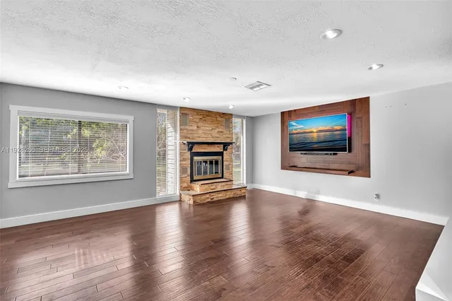 a view of a livingroom with wooden floor