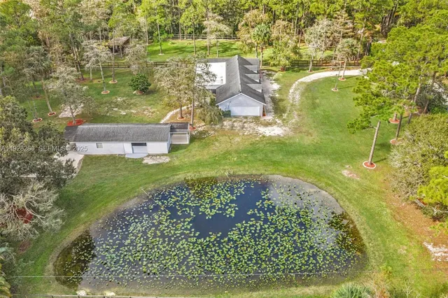 a view of a yard with chairs