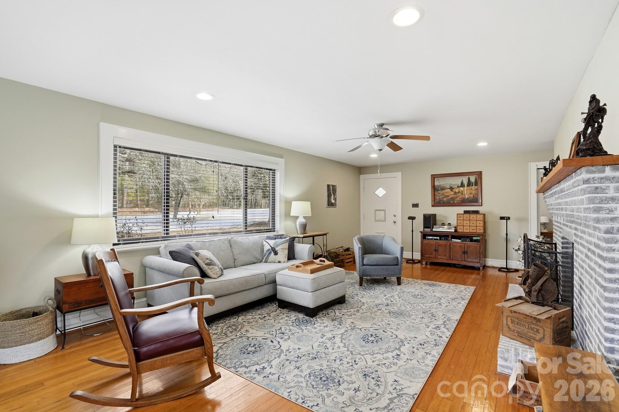 7511 Old Mocksville Road Salisbury, NC 28144 - Photo 12 of 48 a living room with furniture and a fireplace