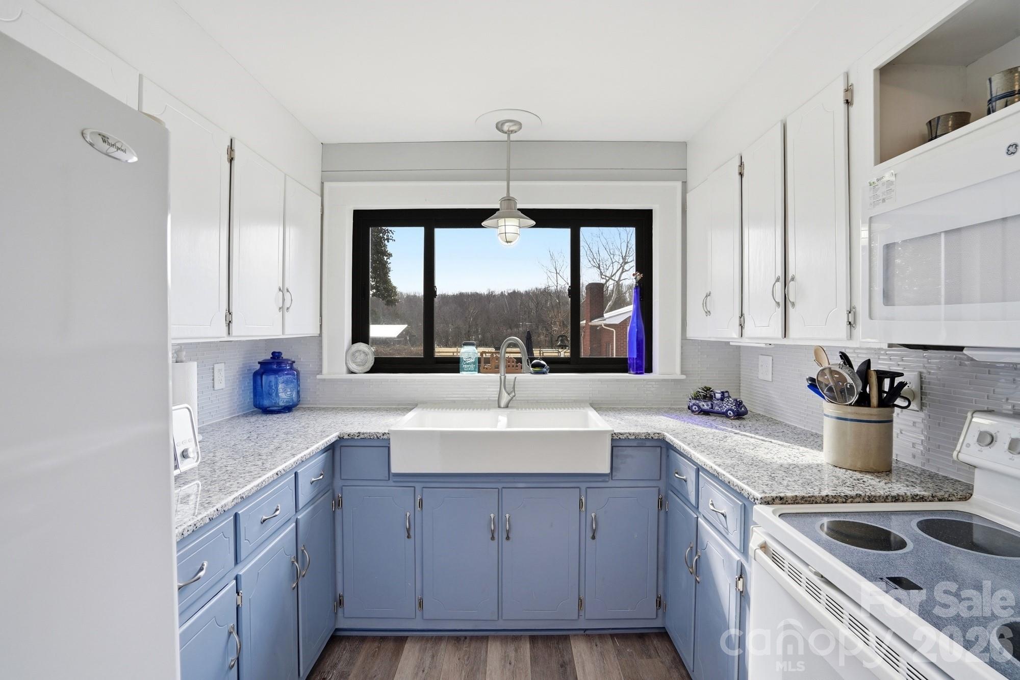 7511 Old Mocksville Road Salisbury, NC 28144 - Photo 17 of 48 a kitchen with a sink cabinets and window