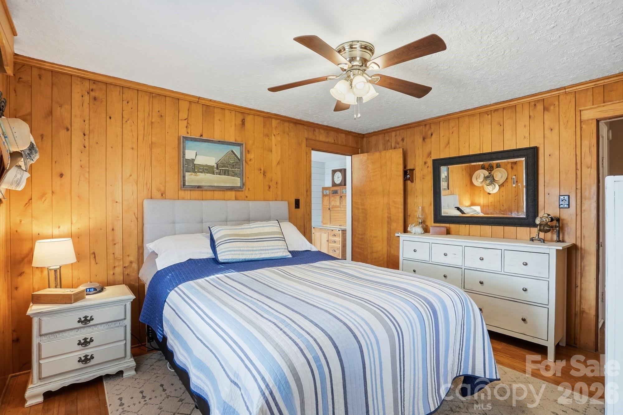 7511 Old Mocksville Road Salisbury, NC 28144 - Photo 22 of 48 a bedroom with a bed and a dresser