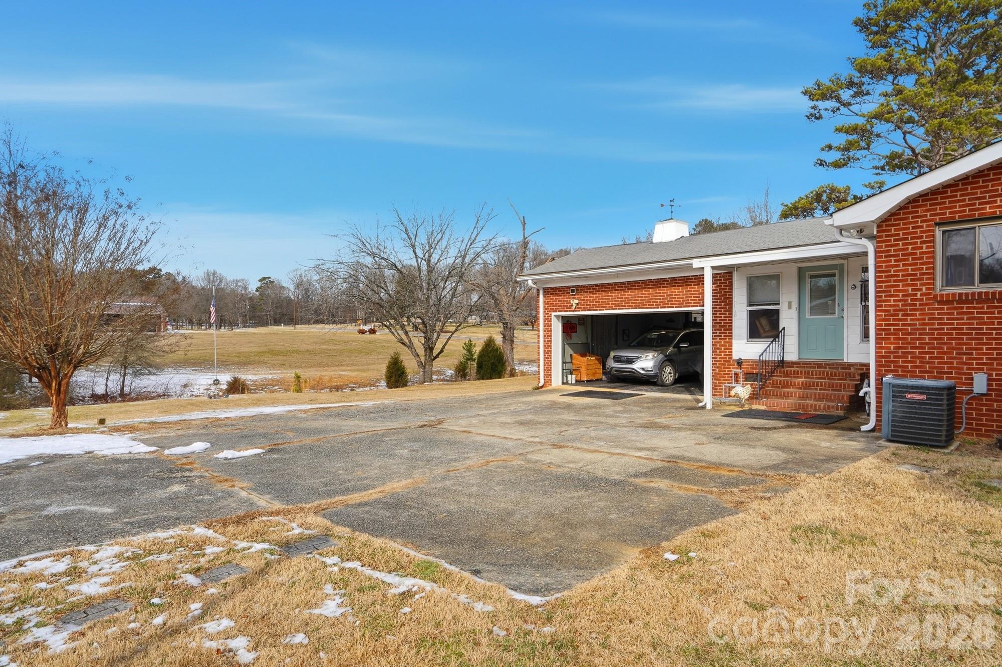 7511 Old Mocksville Road Salisbury, NC 28144 - Photo 27 of 48 a view of a house with a yard and garage