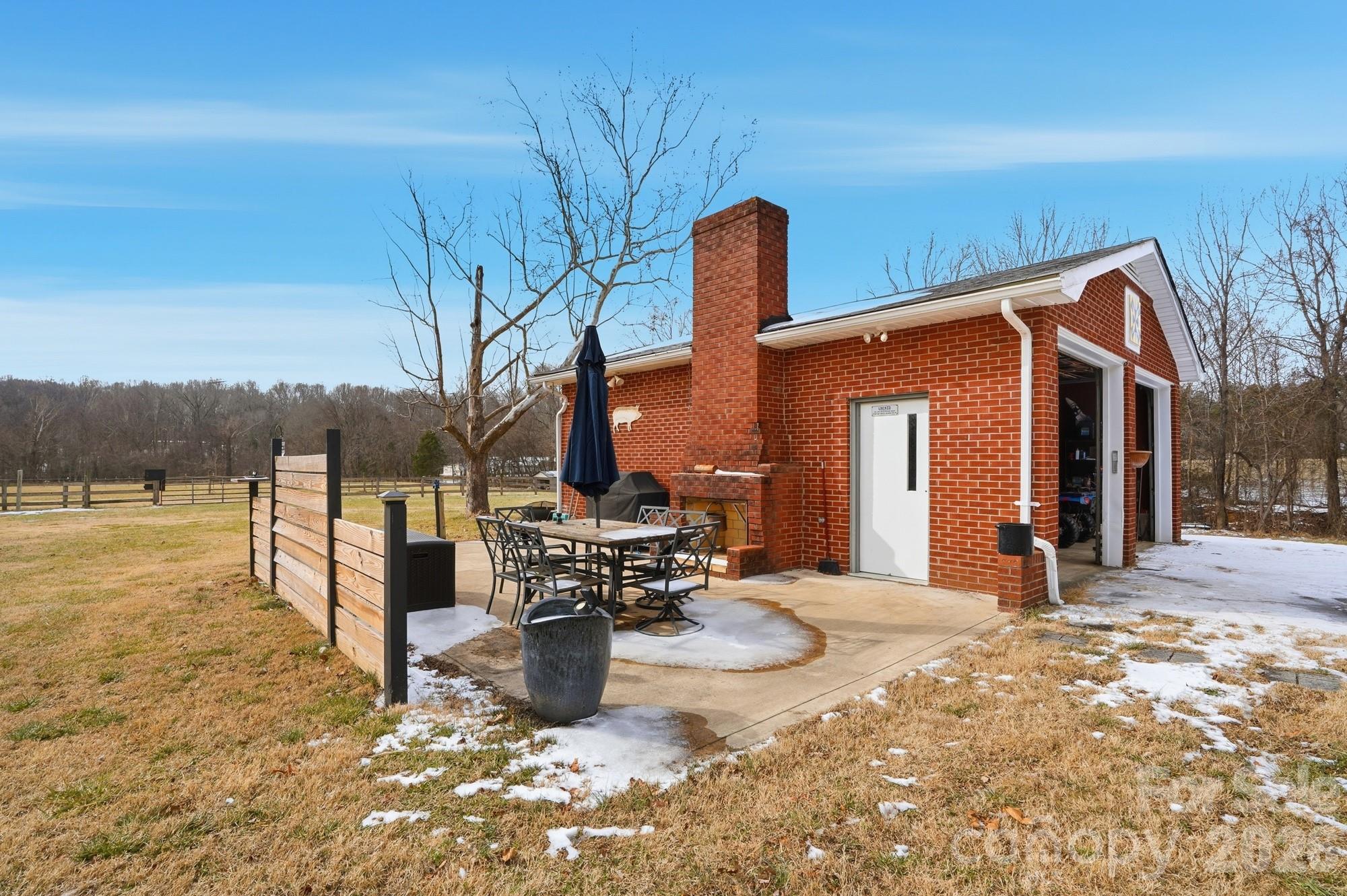 7511 Old Mocksville Road Salisbury, NC 28144 - Photo 30 of 48 a view of the house with backyard outdoor seating and covered with snow