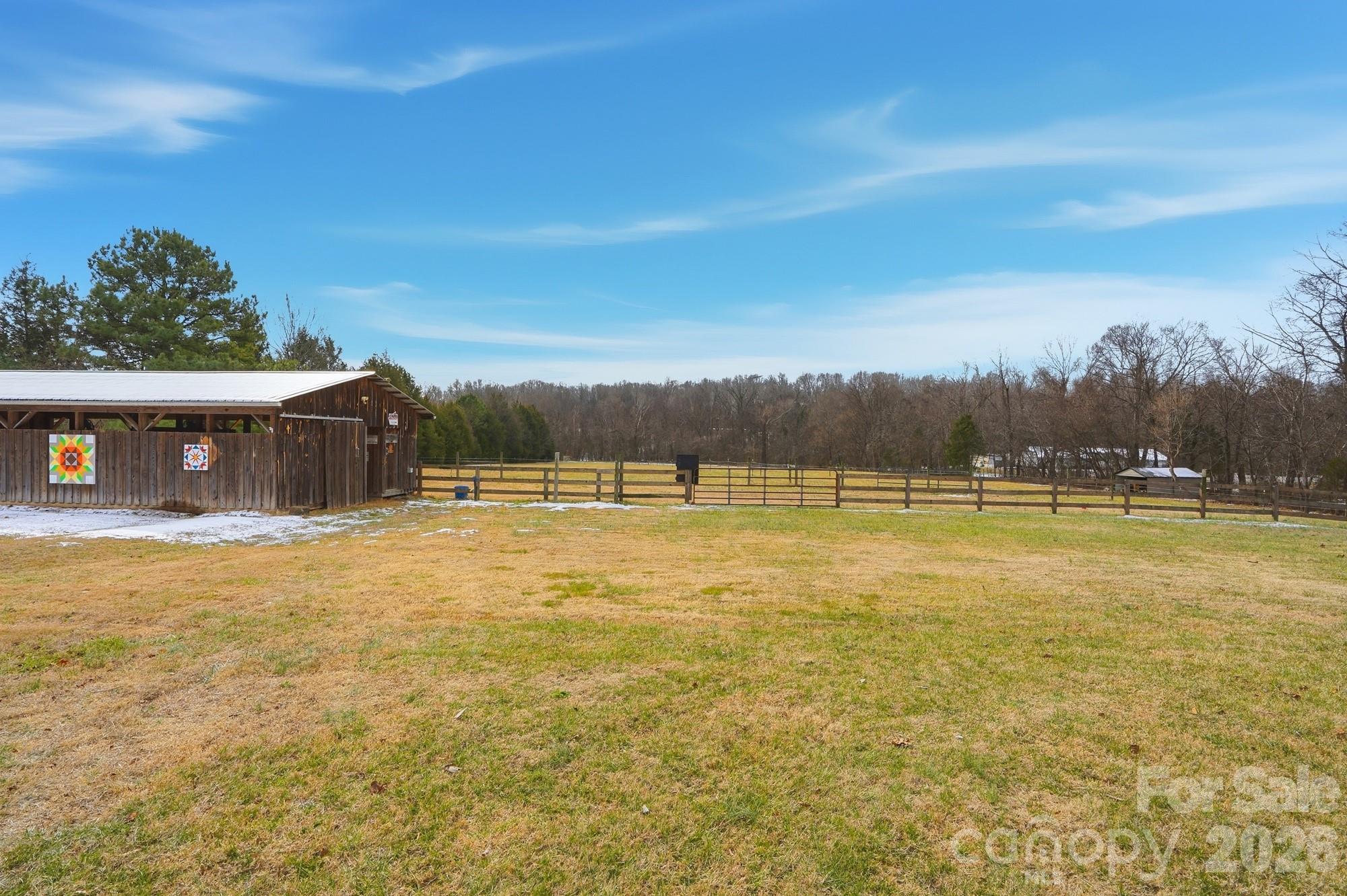 7511 Old Mocksville Road Salisbury, NC 28144 - Photo 34 of 48 a view of a swimming pool with an outdoor seating and a yard