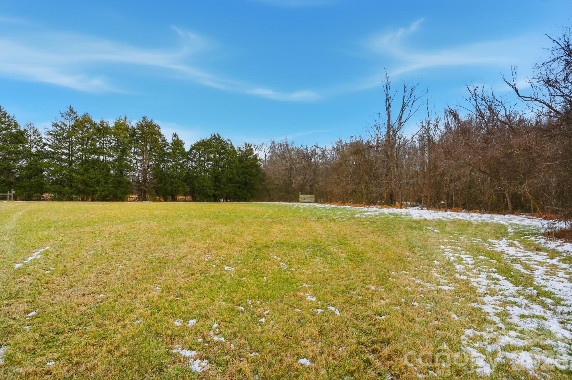 7511 Old Mocksville Road Salisbury, NC 28144 - Photo 40 of 48 a view of a yard with a lake view