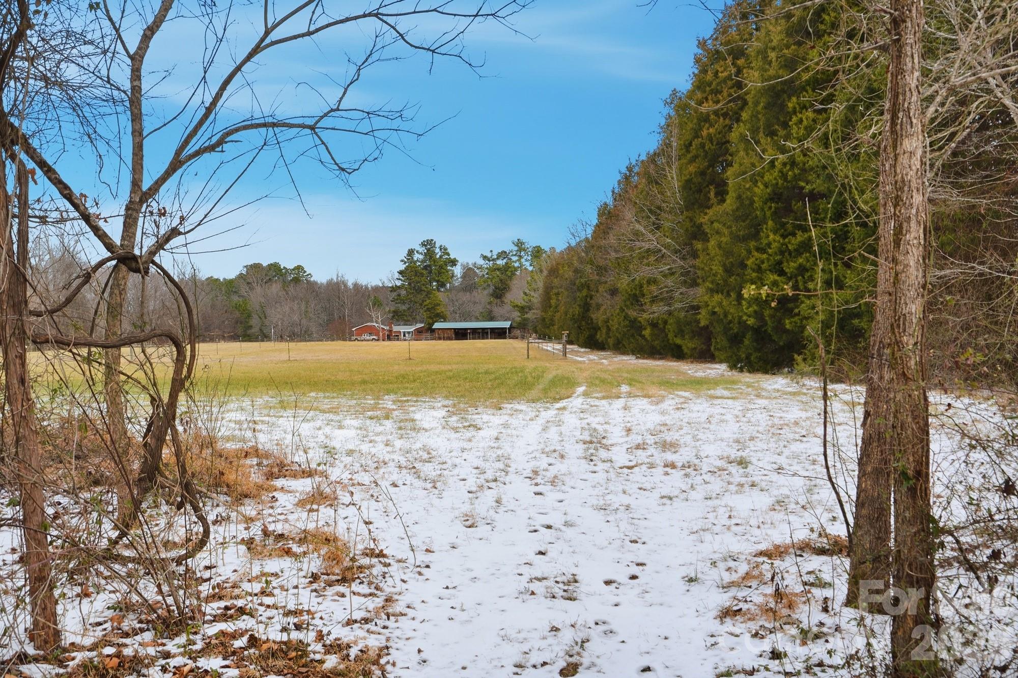 7511 Old Mocksville Road Salisbury, NC 28144 - Photo 43 of 48 a view of a swimming pool with a yard