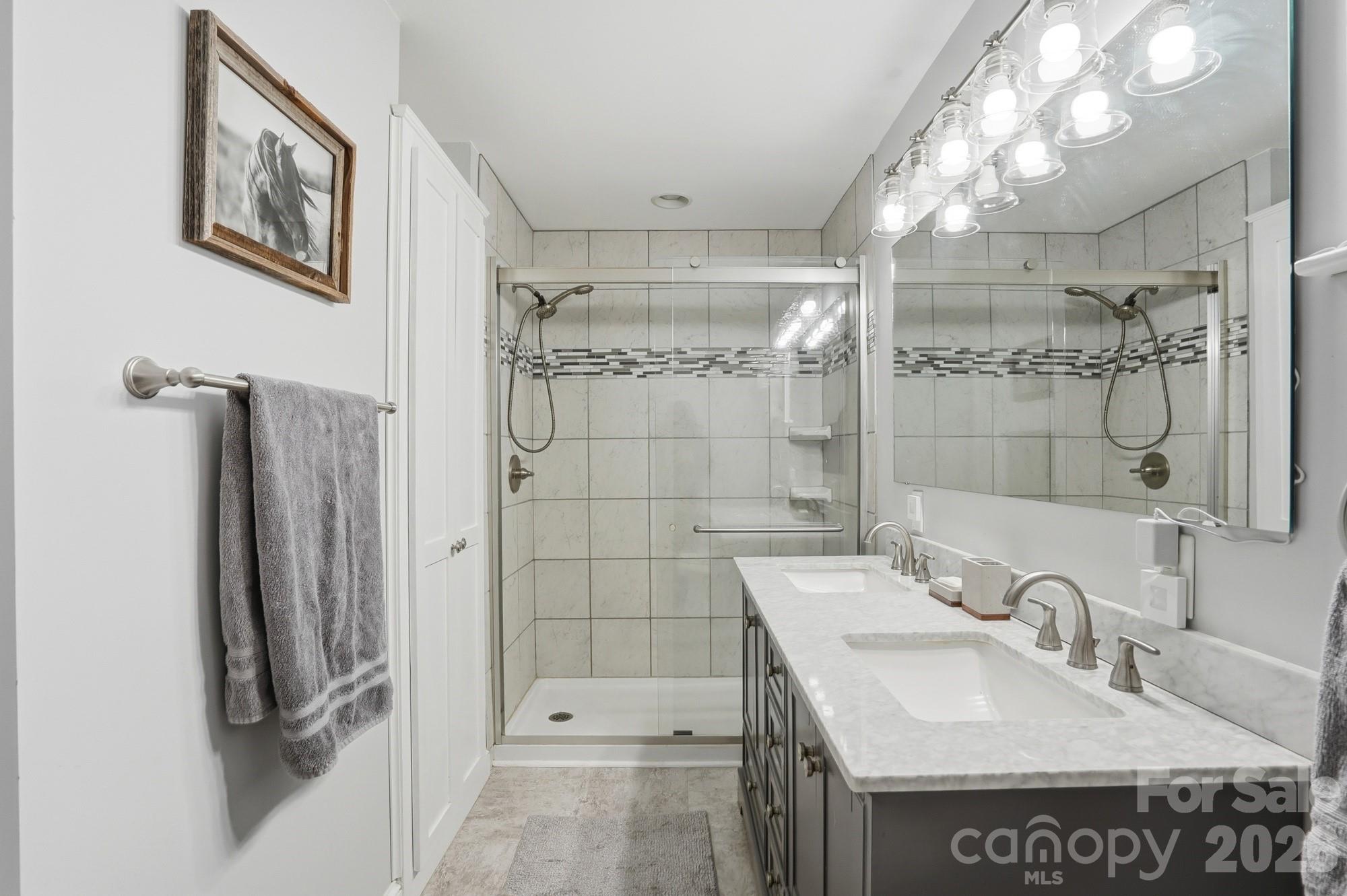 7511 Old Mocksville Road Salisbury, NC 28144 - Photo 5 of 48 a bathroom with a sink a toilet and shower