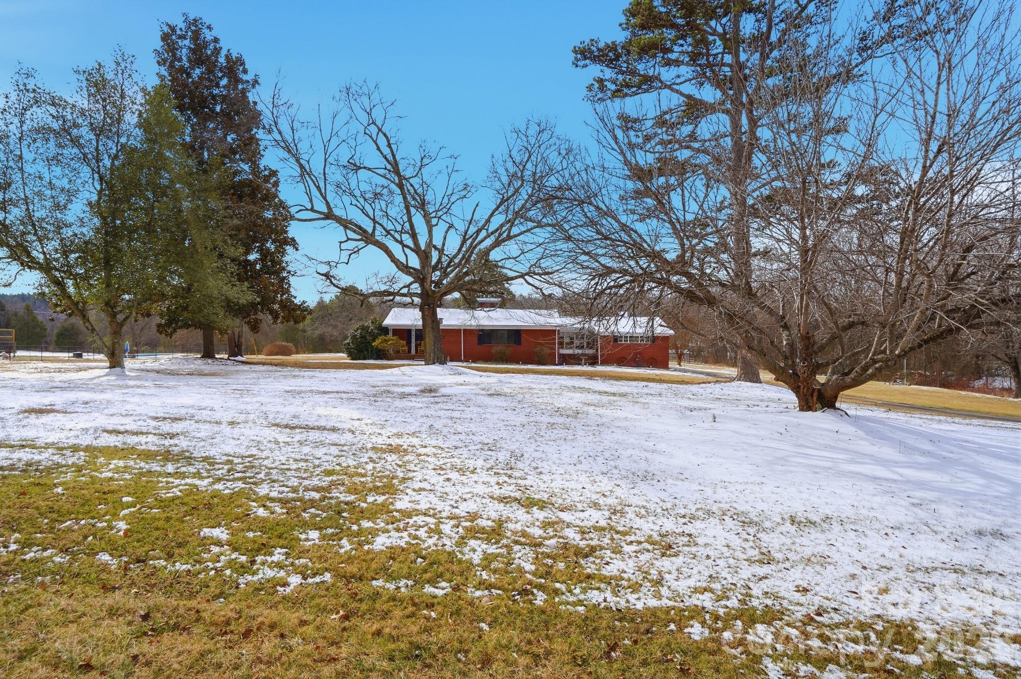 7511 Old Mocksville Road Salisbury, NC 28144 - Photo 10 of 48 a house with trees in front of it