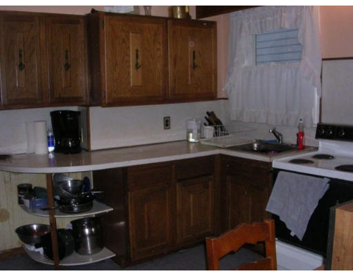 51 Baker Road Everett, MA 02149 - Photo 5 of 10 a kitchen with a sink and cabinets
