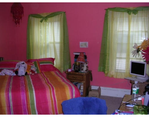 51 Baker Road Everett, MA 02149 - Photo 6 of 10 a bedroom with two beds and a flat screen tv