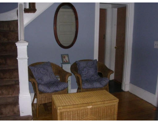 51 Baker Road Everett, MA 02149 - Photo 9 of 10 a living room with furniture and a mirror