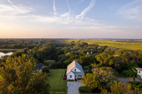 an aerial view of residential house with outdoor space and trees