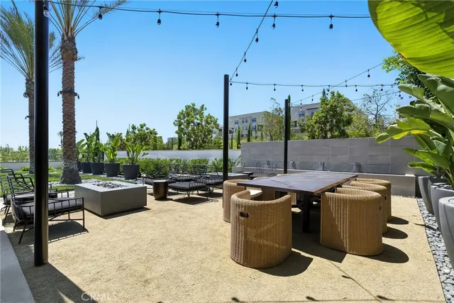 a view of swimming pool with outdoor seating and plants
