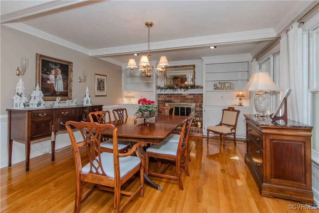 14161 Grangewood Road Midlothian, VA 23113 - Photo 15 of 44 a view of a dining room with furniture window and wooden floor