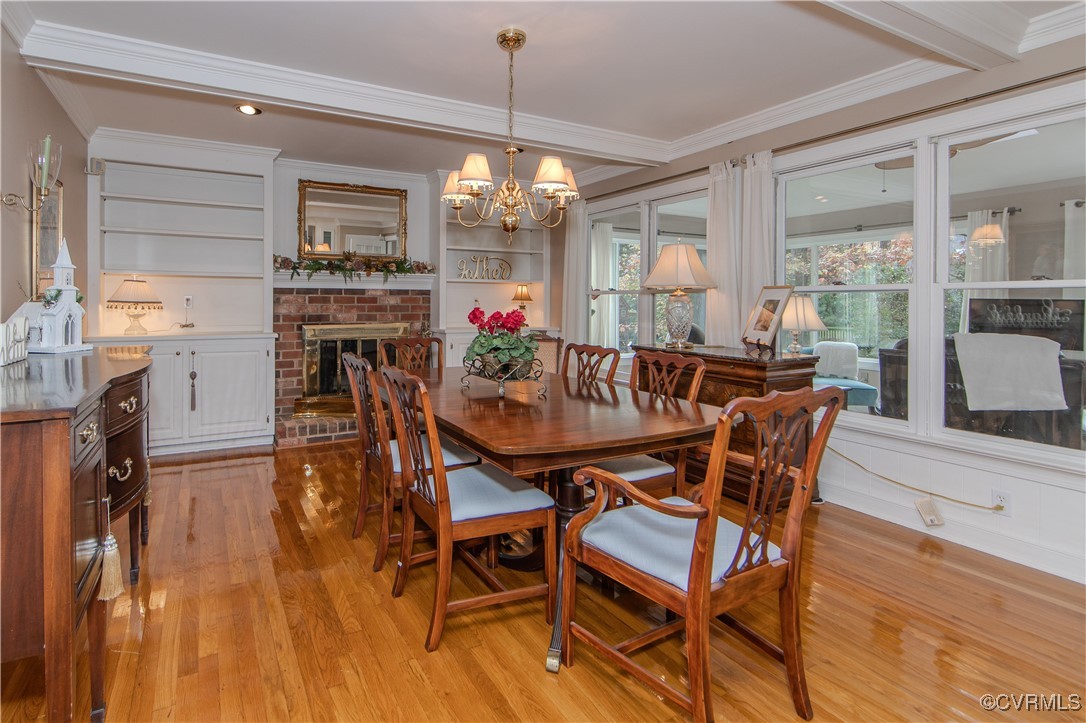 14161 Grangewood Road Midlothian, VA 23113 - Photo 16 of 44 a view of a dining room with furniture window and wooden floor