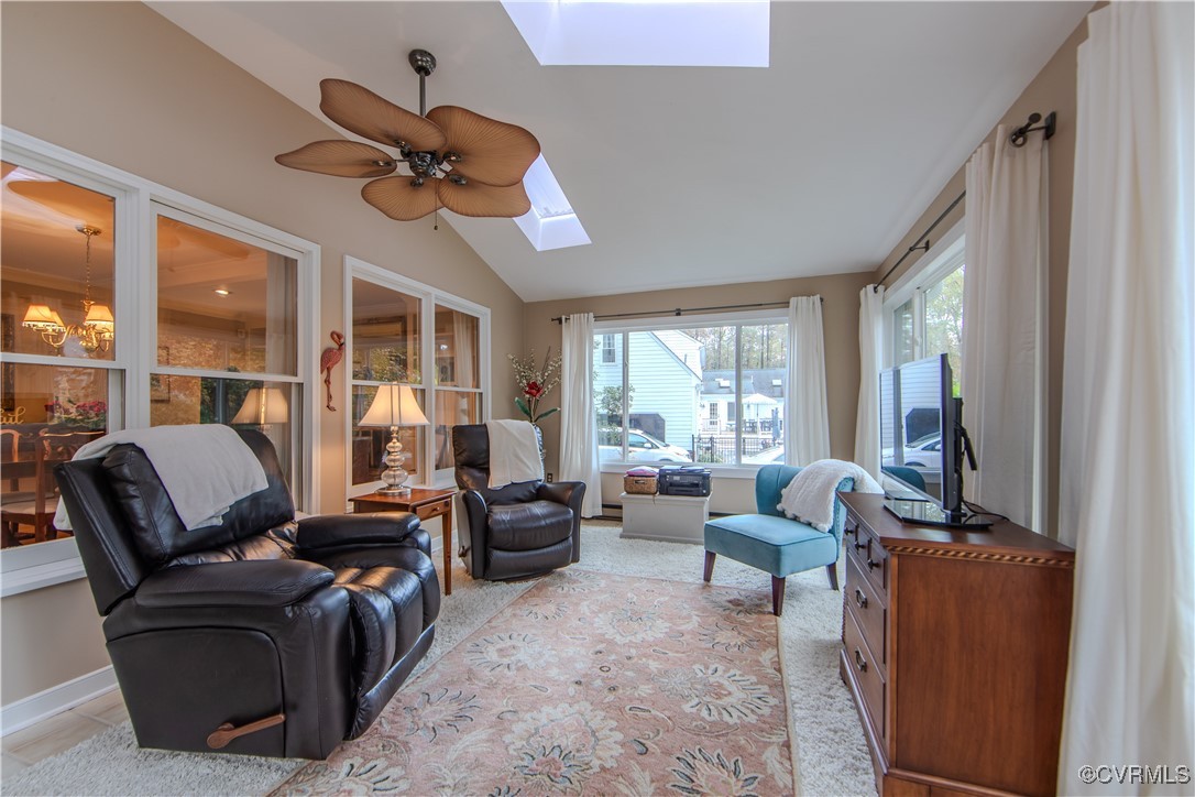 14161 Grangewood Road Midlothian, VA 23113 - Photo 18 of 44 a living room with furniture a ceiling fan and a window