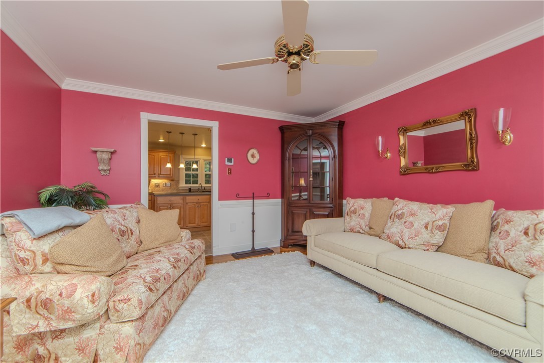14161 Grangewood Road Midlothian, VA 23113 - Photo 20 of 44 a living room with furniture and a chandelier
